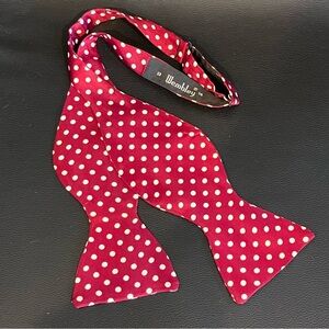 Wembley bow tie adjustable burgundy with cream polka dots.  Like new.